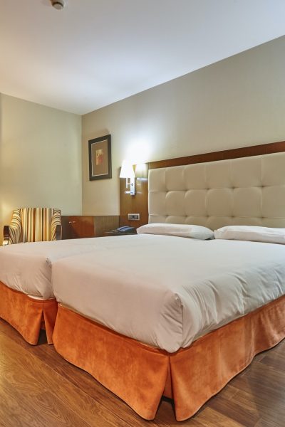 modern-hotel-room-interior-with-two-separate-beds-tourism-business.jpg